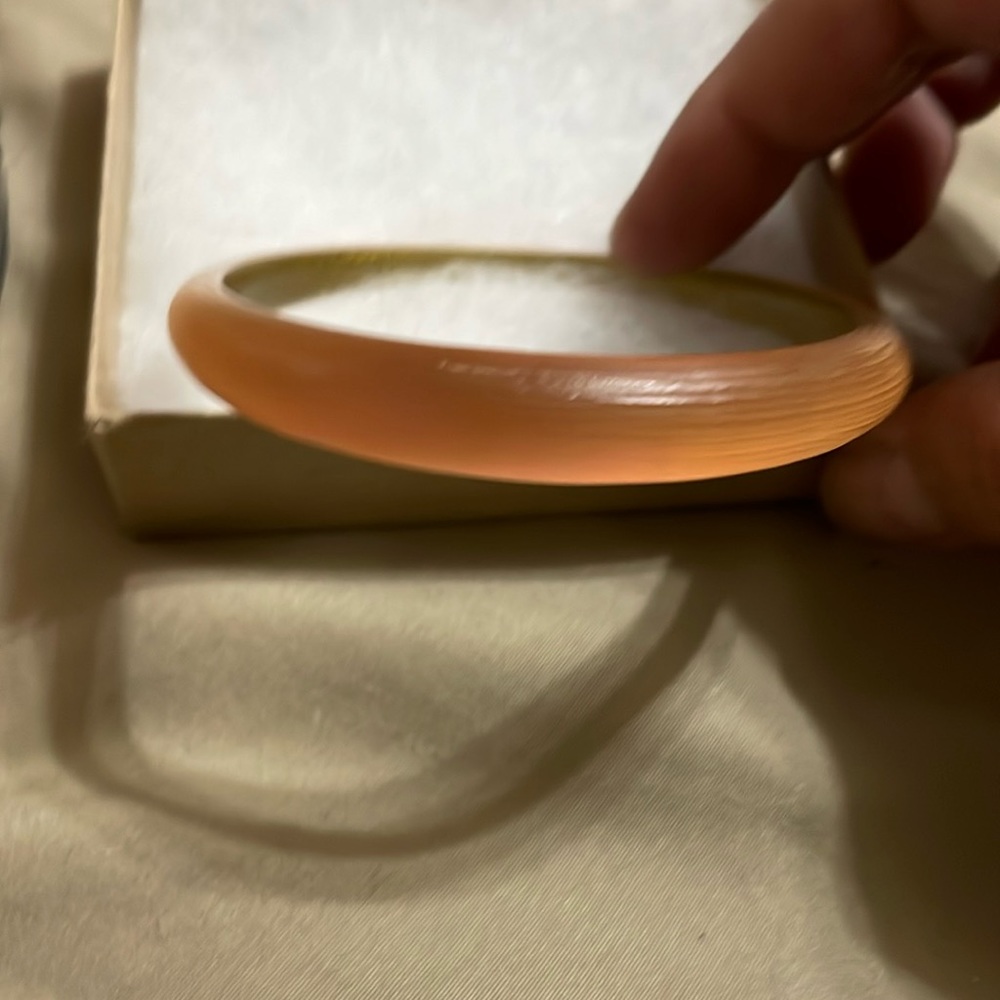 Alexis Bittar beautiful peach/pink/orange color tappered bracelet.